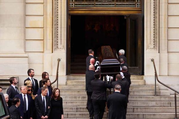Ushers carried Trump Barry's' casket into the Church of St. Ignatius Loyola.