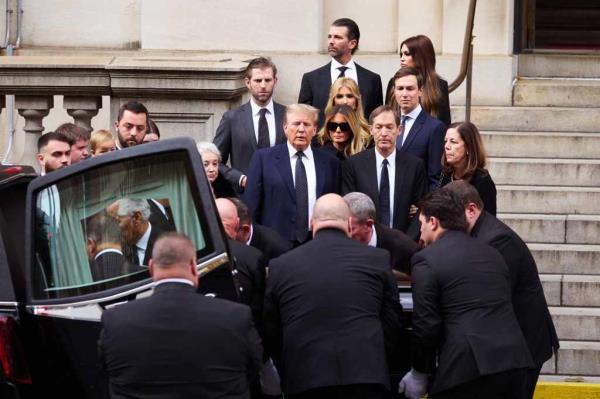 The ex-commander-in-chief, 77, wore a dark navy suit, eschewing his signature red tie in favor of a dark gray necktie. 