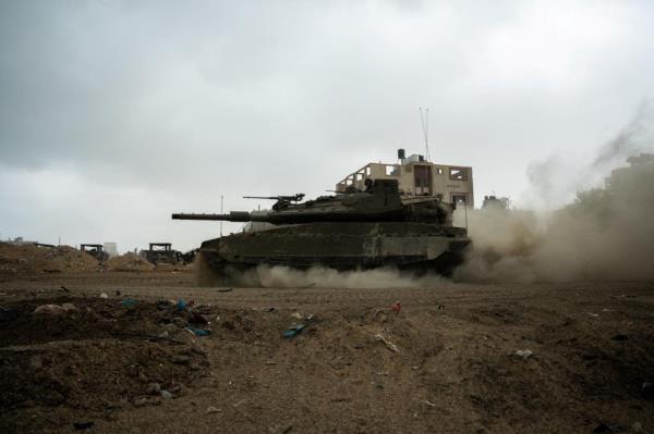 An Israeli soldier rides in a military vehicle, amid the o<em></em>ngoing ground operation of the Israeli army against the Palestinian Islamist group Hamas, on Nov. 20, 2023.