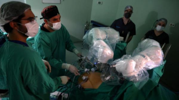 Surgeons use magnetic surgical robot arms, new technology instruments that work with magnetic fields, during an operation at a public hospital, in Santiago, Chile, December 4, 2023. REUTERS/Ivan Alvarado

